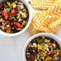 Black bean corn salad with lime dressing, canned black beans, tomatoes, corn, cilantro, and bell peppers.