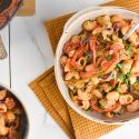 Creamy Cajun Chicken Pasta with peppers, onions, chicken breast, and a creamy cajun sauce in a bowl.