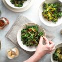 Kale chips that are baked in the oven and served in bowls with different spice blends.