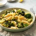 Lemon broccoli pasta in a bowl with fresh lemon juice, garlic, and Parmesan cheese.