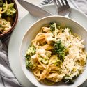 One pot creamy chicken broccoli pasta with a creamy parmesan sauce, fresh broccoli, and chicken breast in two bowls.