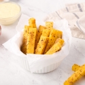 Polenta fries baked with Parmesan cheese and Italian seasoning served with ketchup on the side.