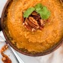 Slow cooker butternut squash served in a wooden bowl.