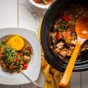 Slow cooker ratatouille with eggplant, zucchini, tomatoes, and mushrooms served with polenta on the side.