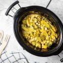 Slow cooker Curry Chickpeas with Vegetables in a black crockpot.