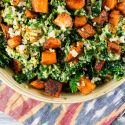 Southwestern sweet potato, kale, and quinoa salad in a bowl with a creamy avocado and lime dressing. 