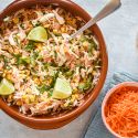 Spicy cabbage slaw with corn and shredded carrots in a creamy lime dressing.