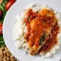 Tomato basil chicken with chicken breast served in a hearty tomato sauce with basil served over rice.