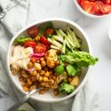 Vegetarain shawarma bowl with roasted chickpeas, cauliflower, and fresh vegetables.