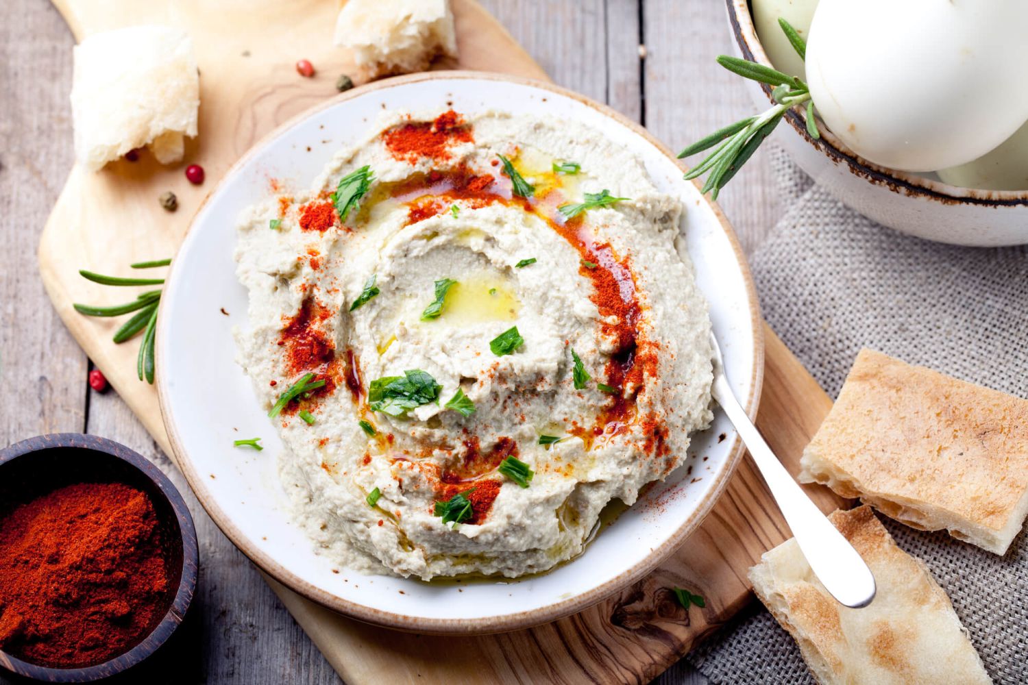 Eggplant dip in a bowl with paprika and olive oil.