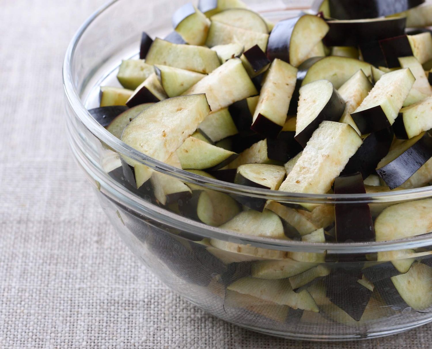 Chopped eggplant in a bowl ready for a recipe.