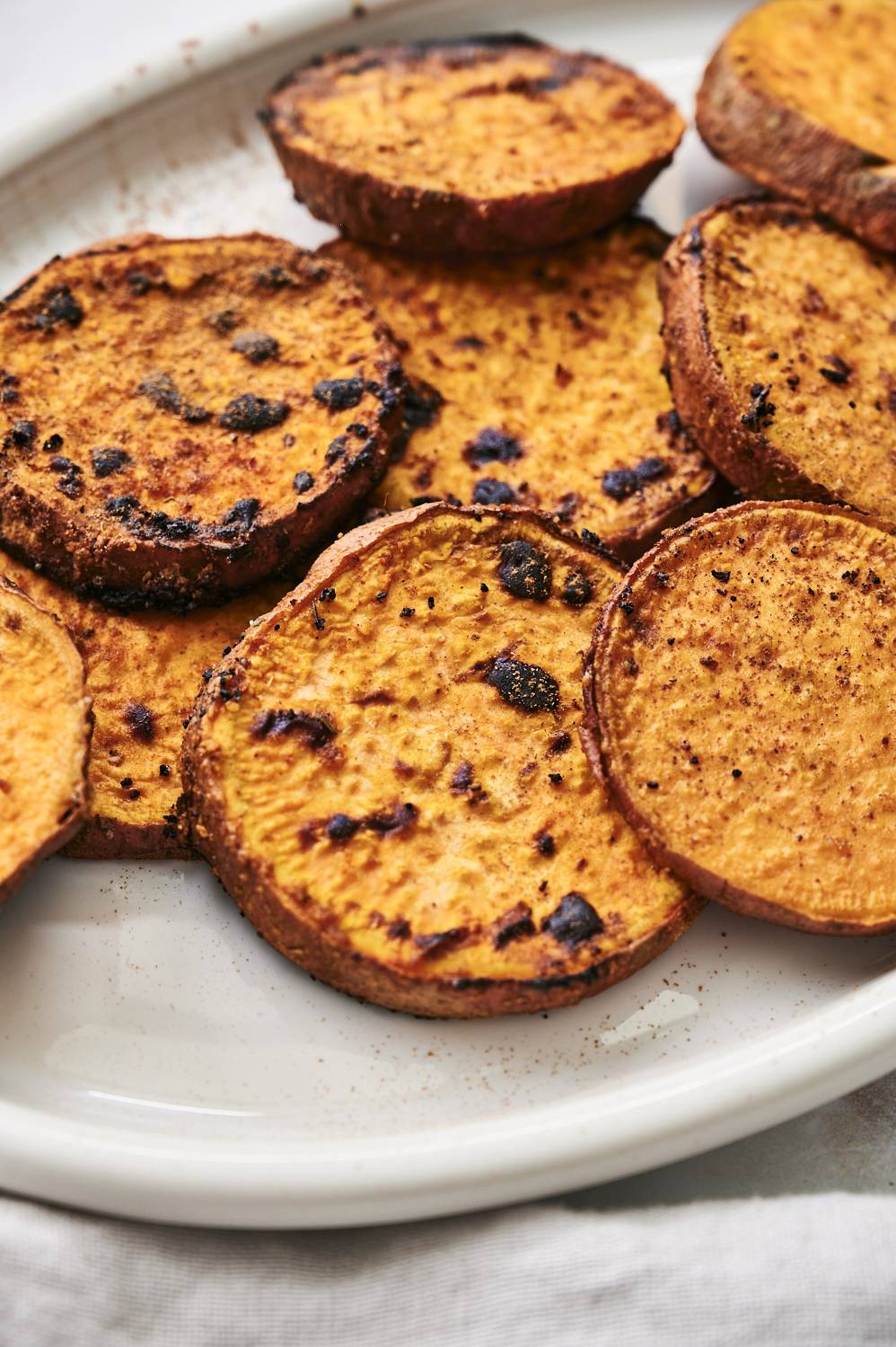 Platter of grilled sweet potatoes with a homemade spice blend.