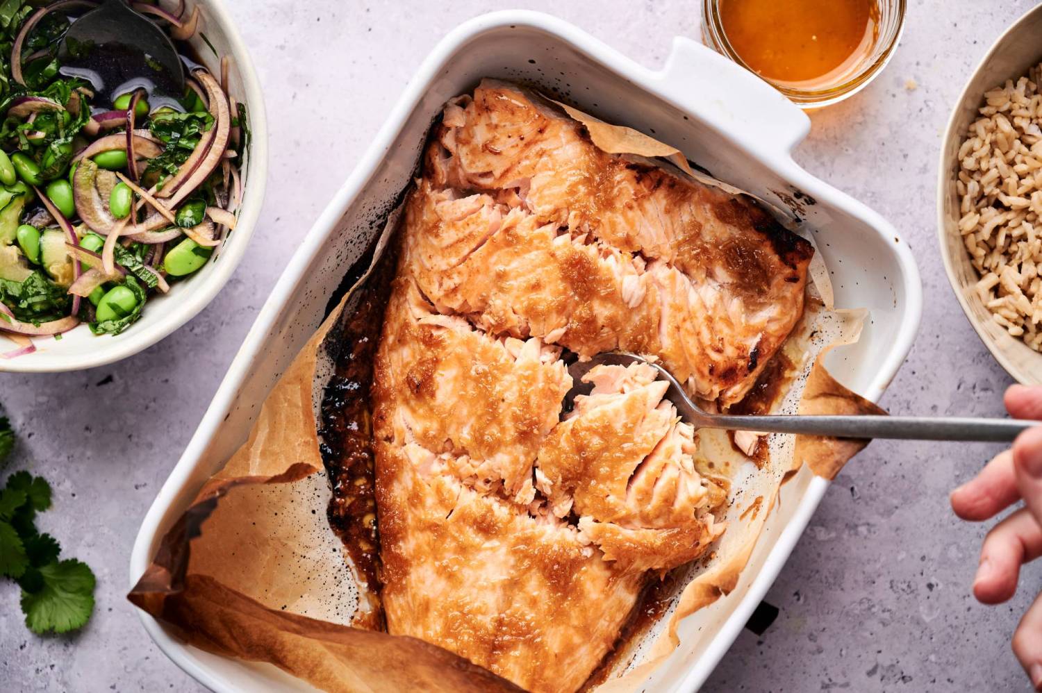 Baked salmon for salmon and rice bowls covered with a soy, ginger, and garlic marinade.