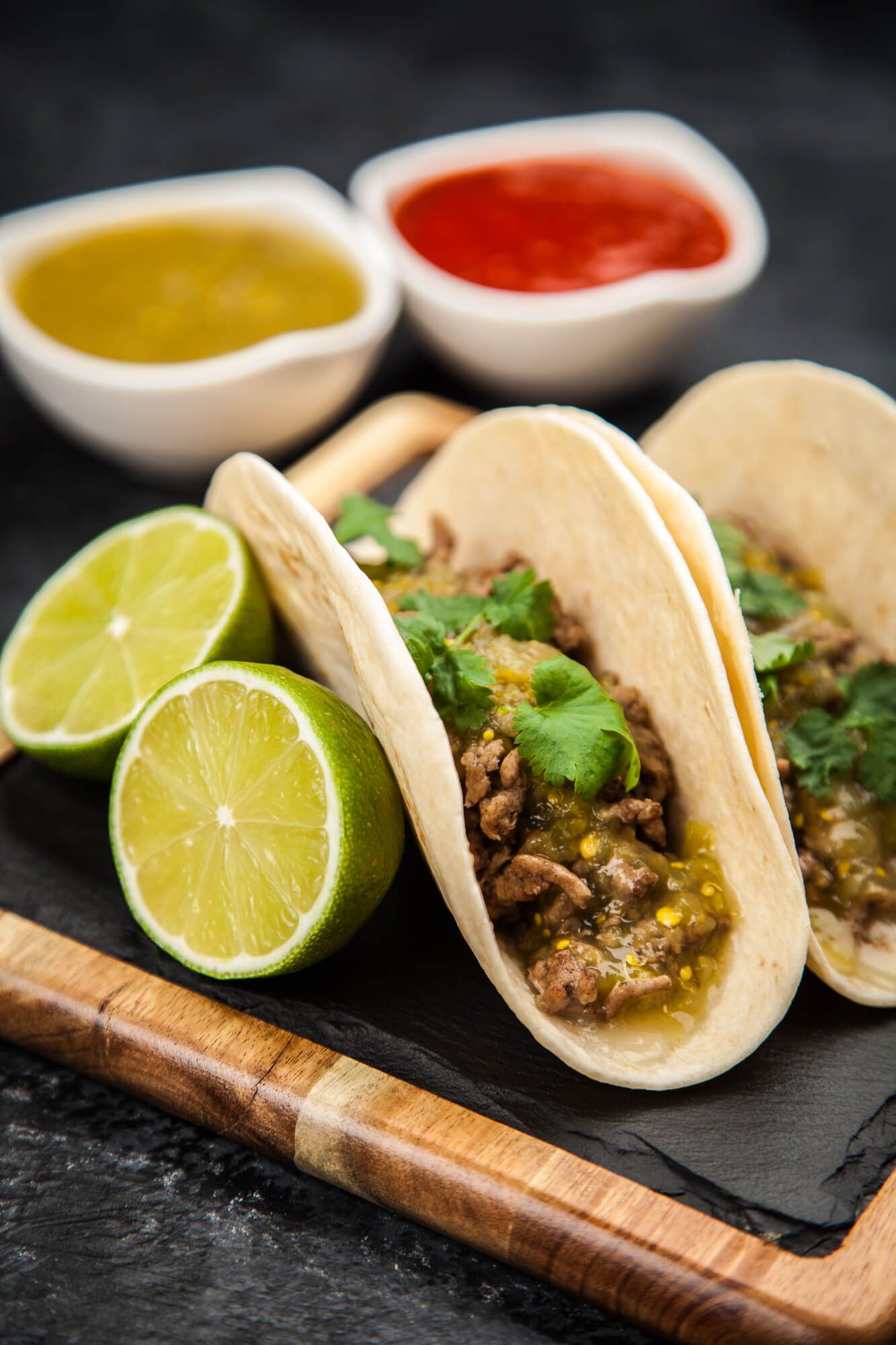 Salsa verde ground turkey tacos in corn tortillas with jalapenos, cilantro, and limes.