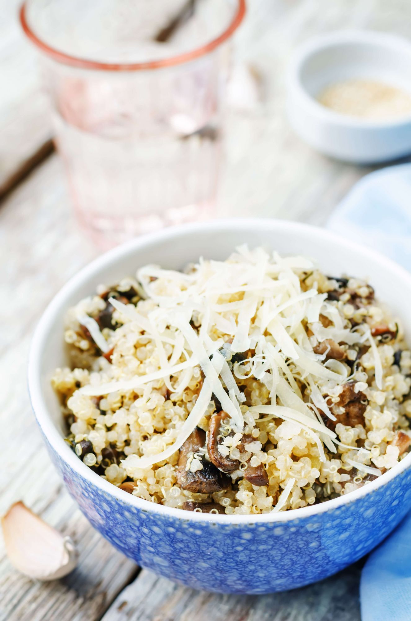 Slow cooker quinoa with mushrooms and Parmesan cheese in a bowl.