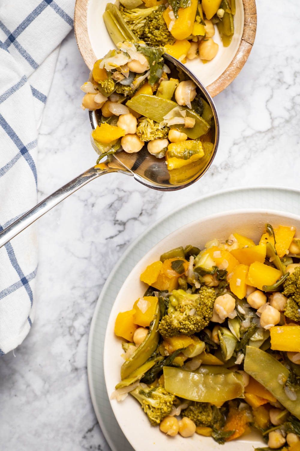 Crockpot Chickpea Curry with vegetables in a wooden bowl.