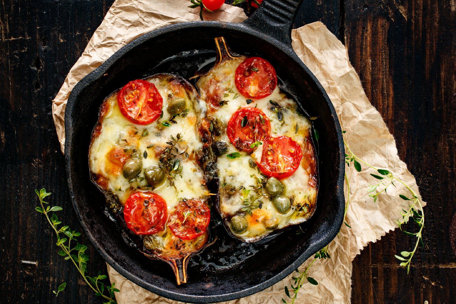 Stuffed eggplant with melted cheese and tomatoes.