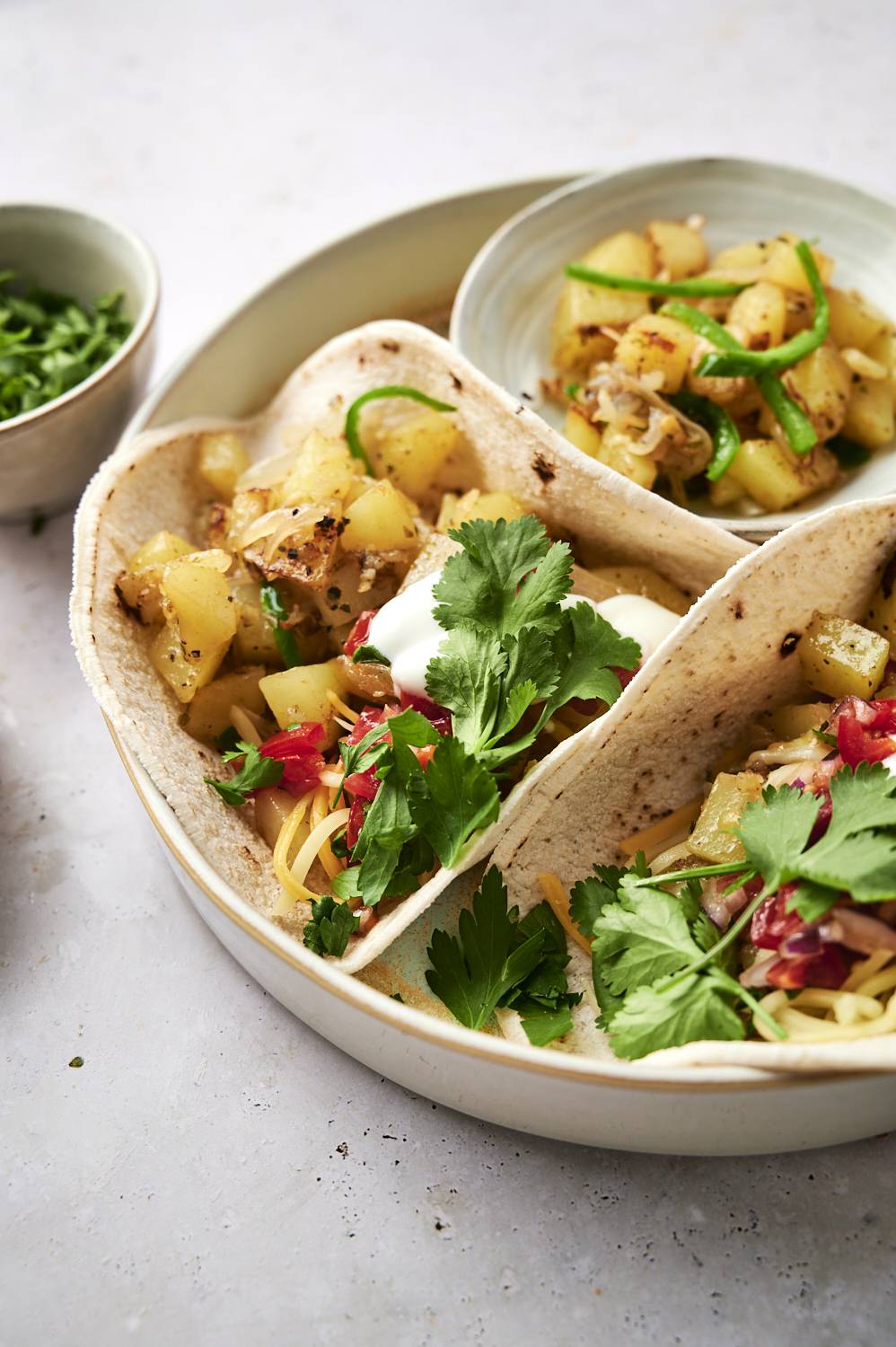 Mexican potato tacos with sauteed potatoes, poblano peppers, onions, and salsa. 