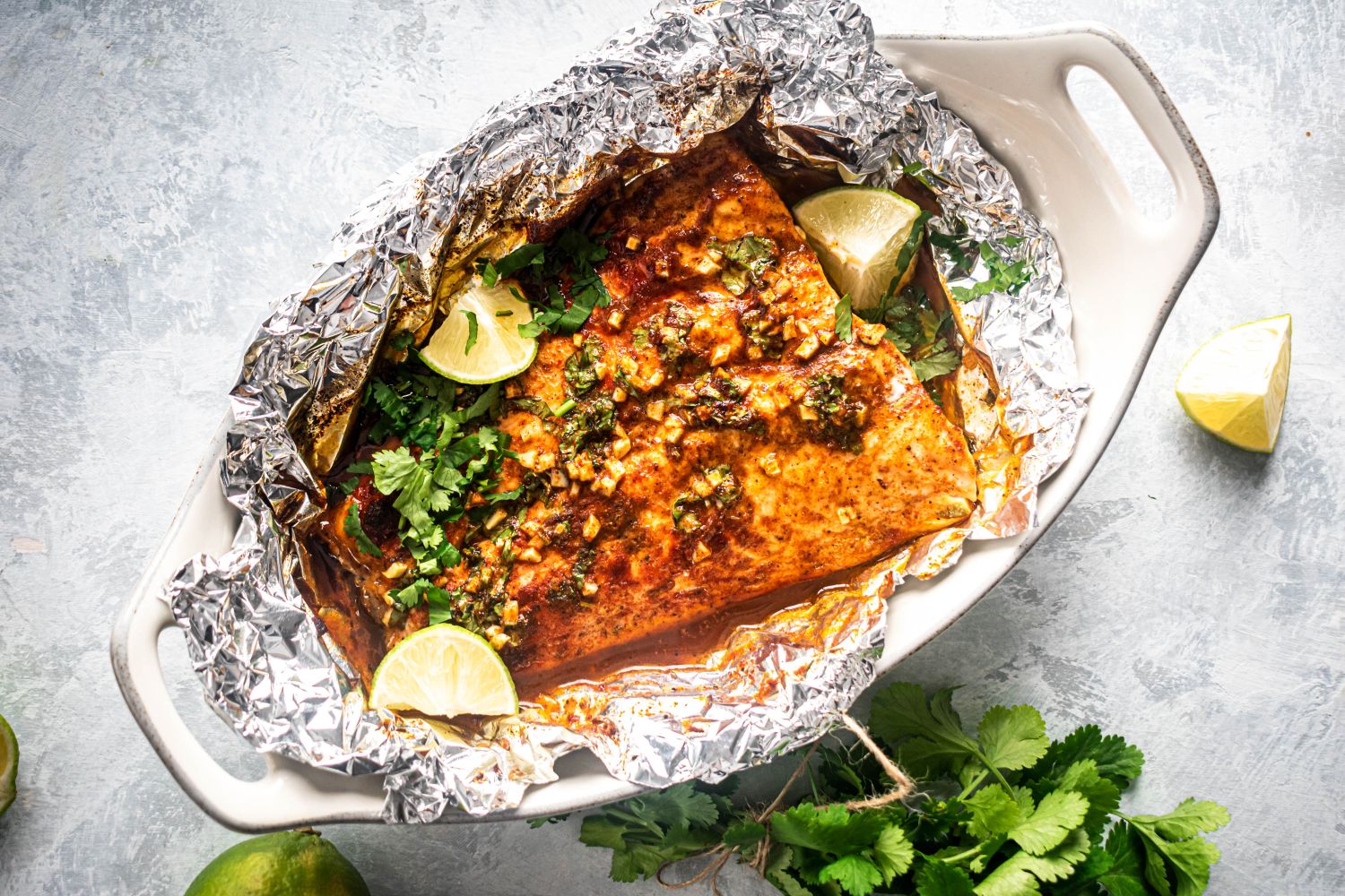 Cilantro lime salmon with garlic, butter, cilantro, and honey baked in a foil pouch.