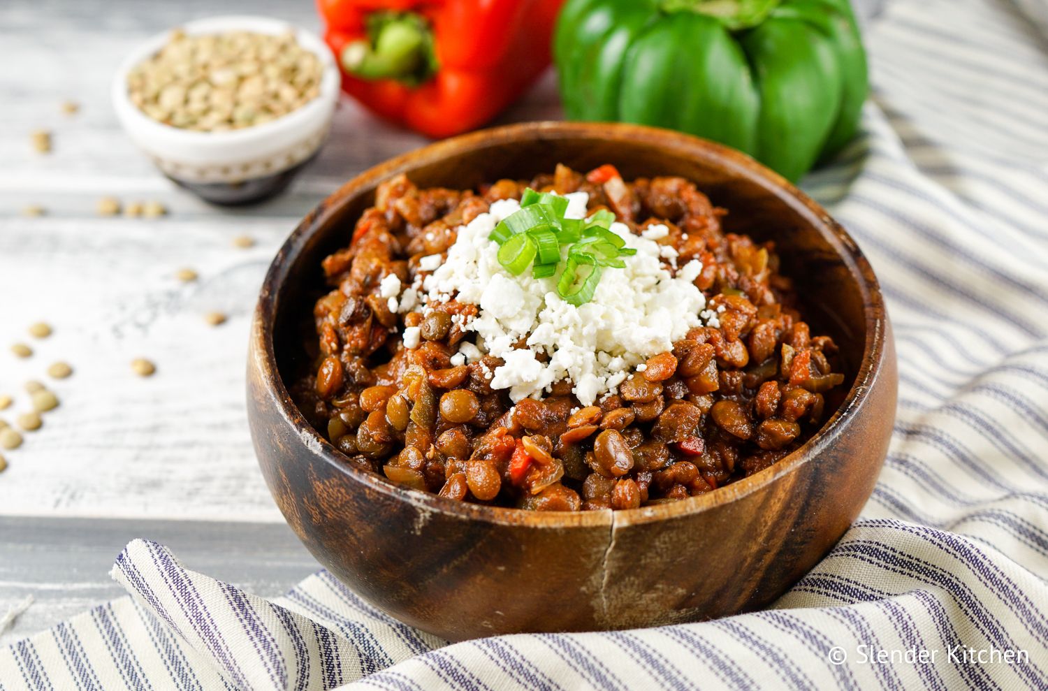 Slow Cooker Tuscan Lentil Sloppy Joes in a wooden bowl make a delicious crockpot Italian meal.