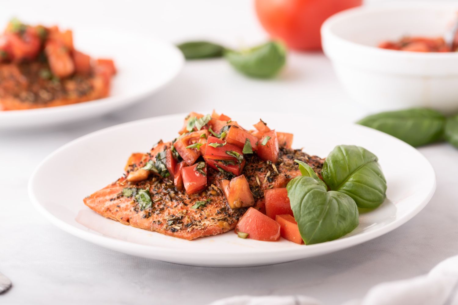 Baked Italian salmon with Italian seasoning, basil, and fresh tomato salsa.