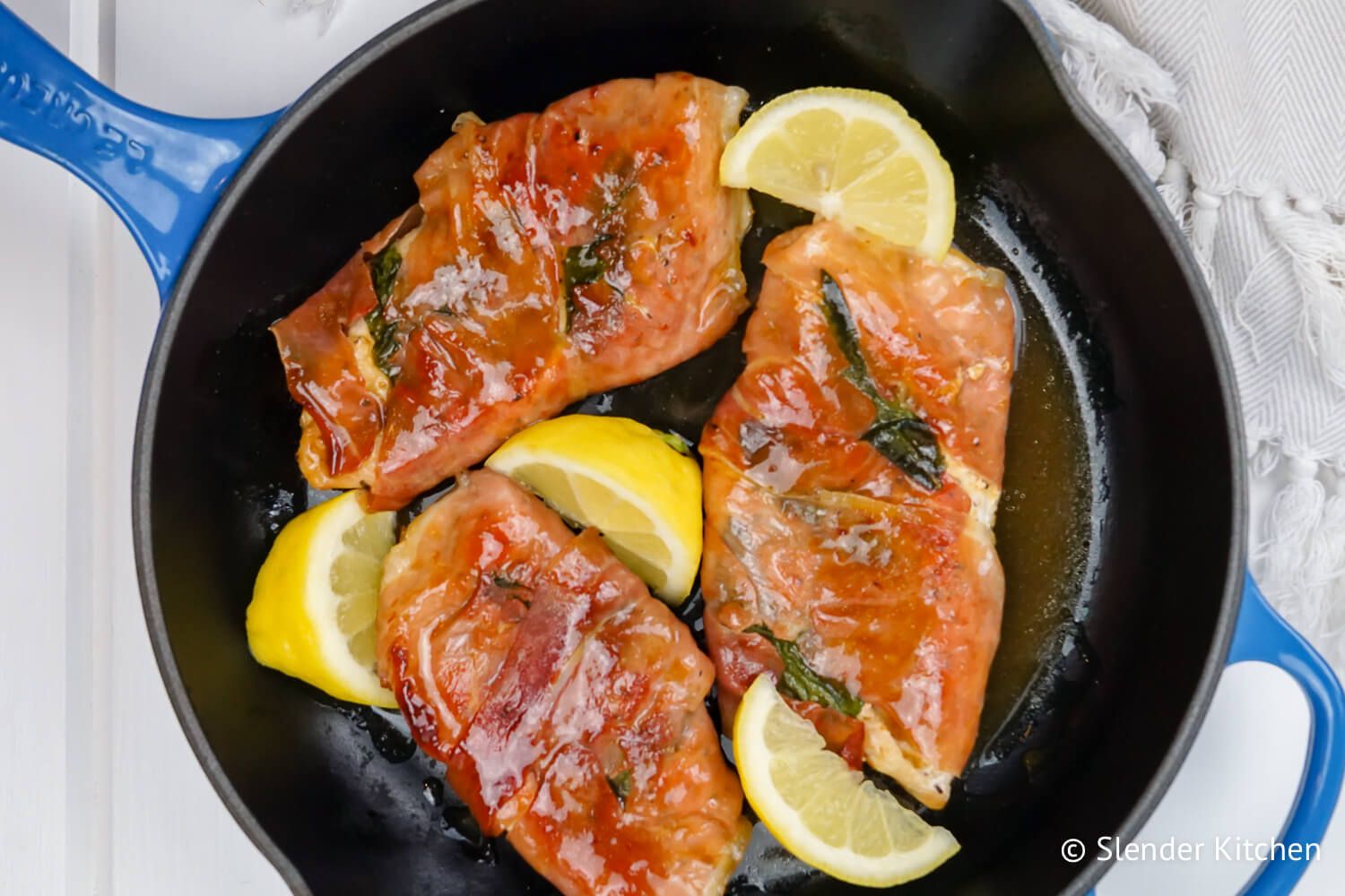 Chicken Saltimbocca with prosciutto and sage in a cast iron skillet.