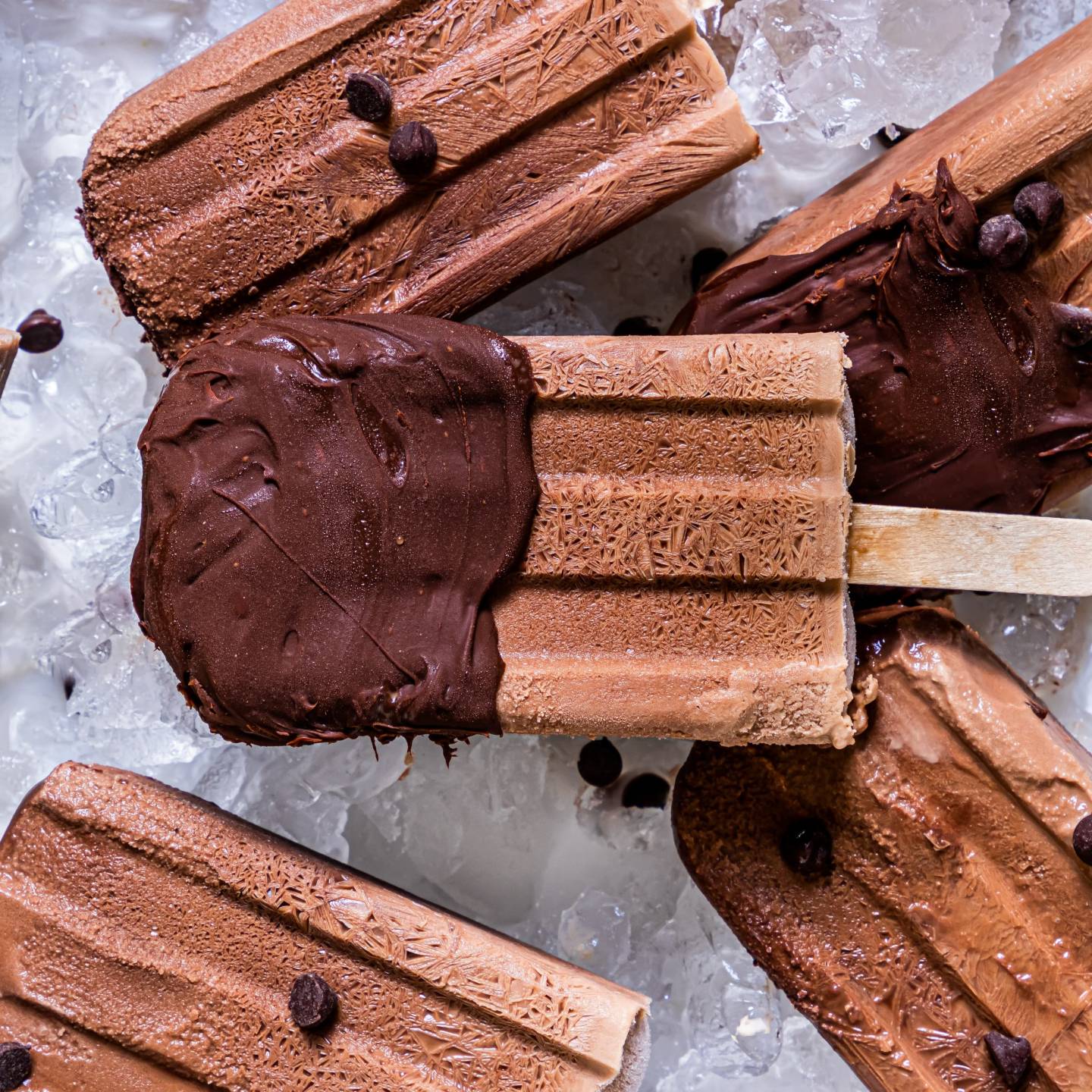 Healthy fudgesicles made with Greek yogurt frozen with chocolate chips.