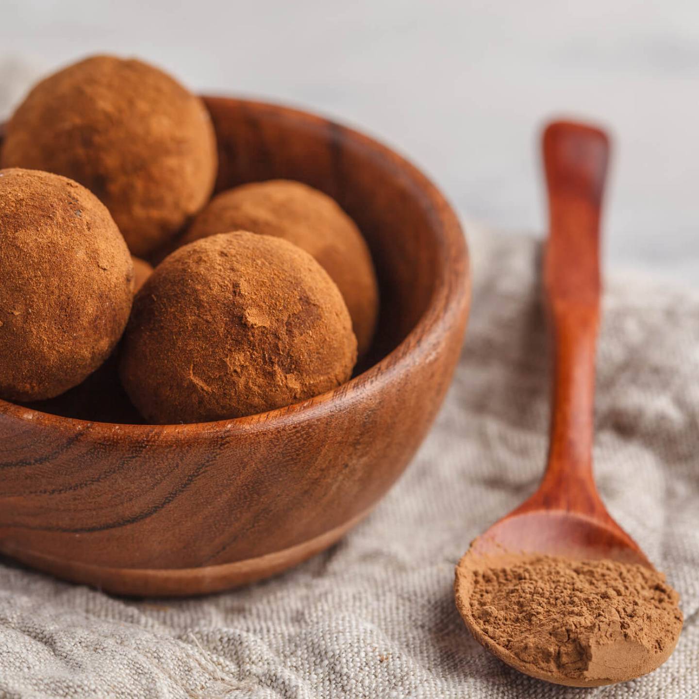 No Bake Brownie bites with cocoa powder dusted on the outside.