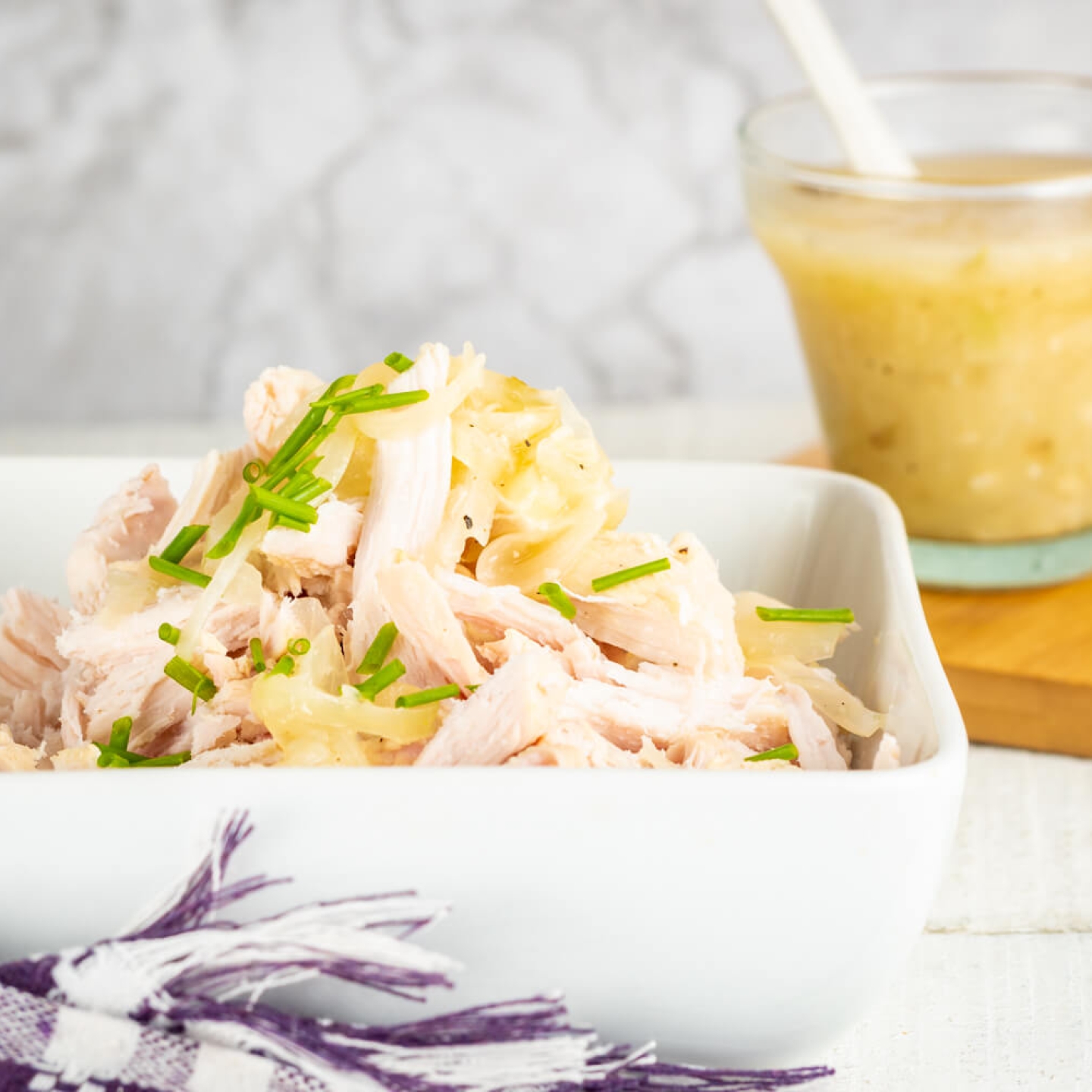 Slow Cooker Lemon Garlic Chicken with onions, fresh lemon, and lots of garlic.