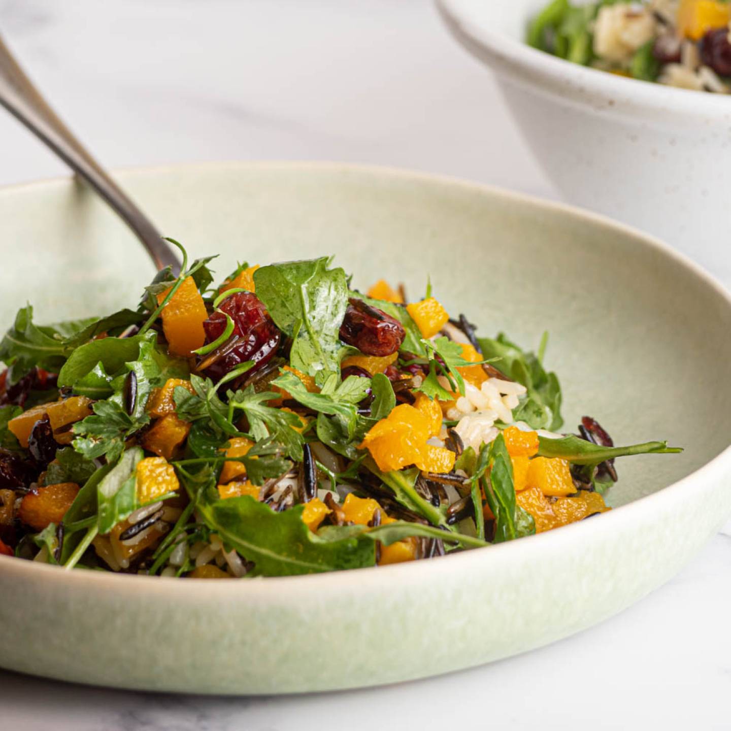 Wild rice salad with acorn squash, cranberries, arugula, and a lemon dressing.