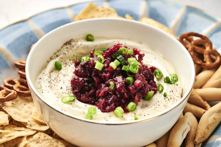 Cranberry jalapeno cream cheese dip sitting in a bowl.