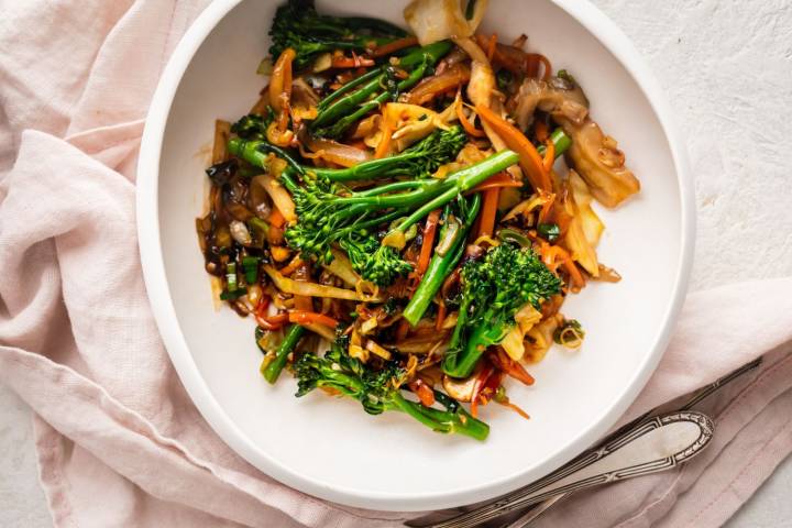 Make the most delicious stir-fried vegetables in just 10 minutes using any combination of veggies you like!  The stir fry sauce is made with pantry staples and makes any vegetables taste amazing. #sidedish #kidfriendly #quickandeasy #stirfry