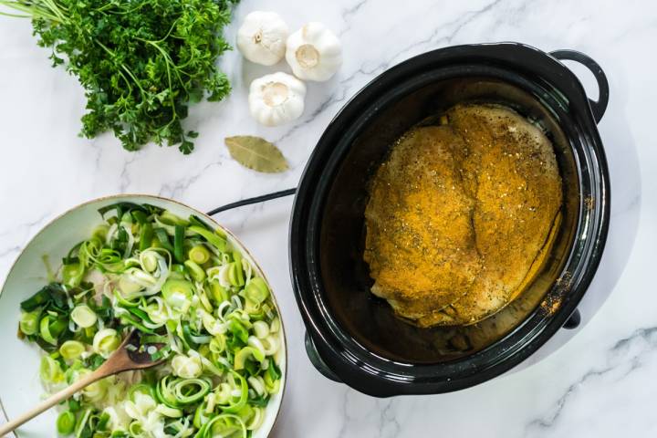 Chicken with spices in a slow cooker.