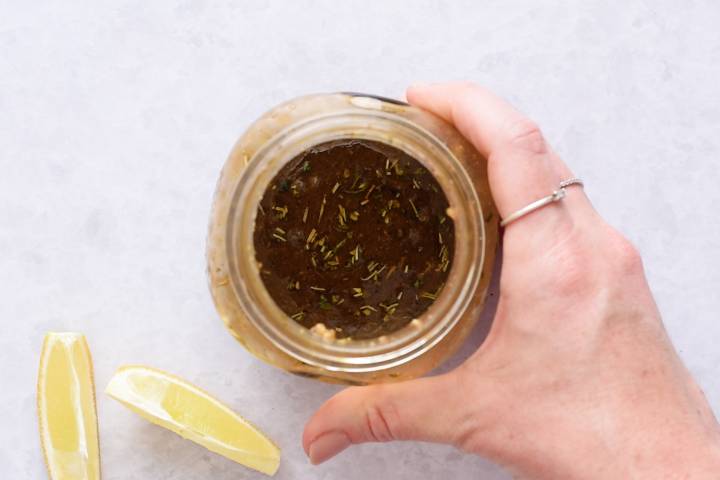 Balsamic marinade for grilling vegetables in a small glass jar.