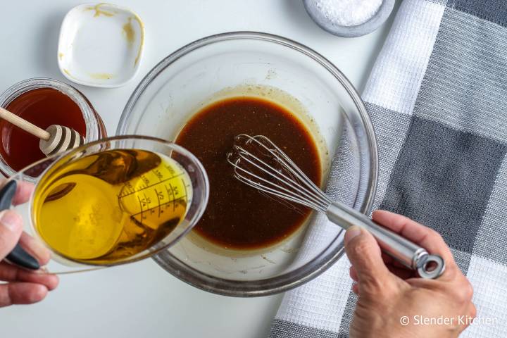 Whisking ingredients for balsamic vinaigrette.