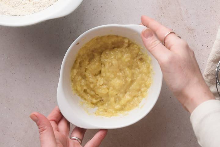 Mashed banana in a small bowl.