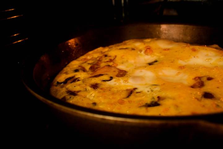 Corn and bacon frittata cooking in the oven.