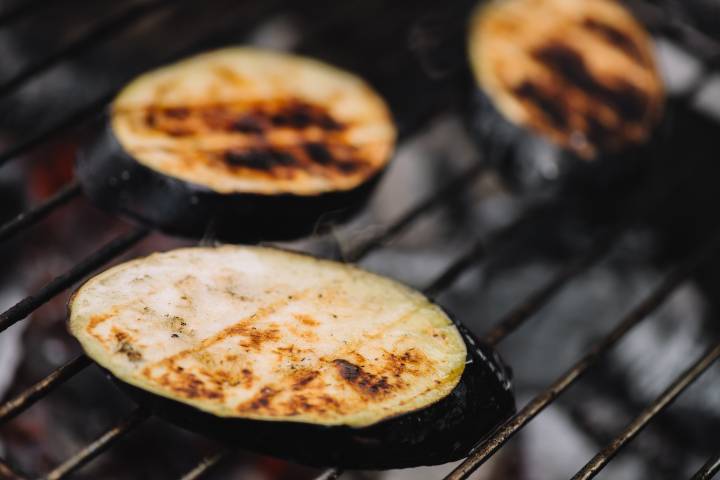 Eggplant sliced on the grill with grill marks.