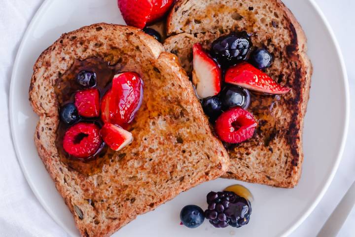 French toast made with whole grain bread and served with berries.