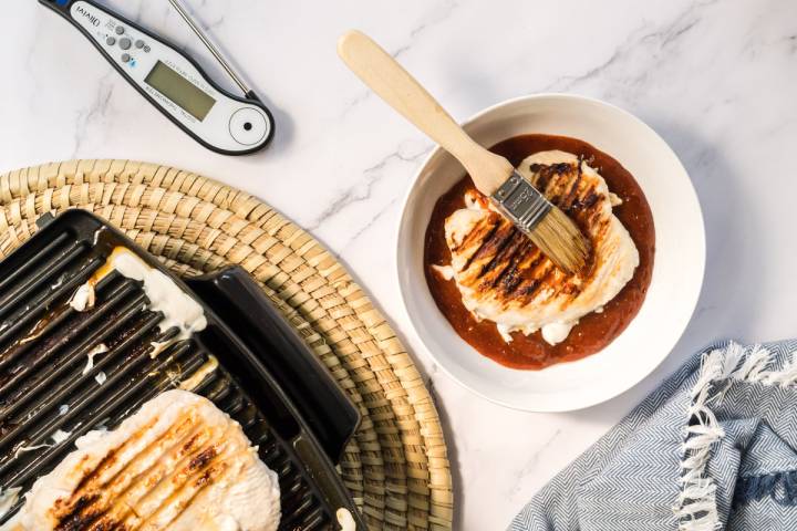 Chicken bring cooked on the grill and brushed with chipotle honey sauce.