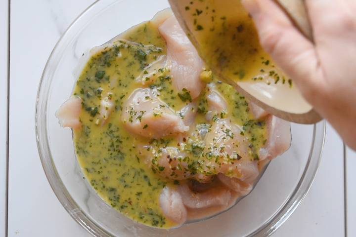 Chicken marinating in a honey and lime marinade.