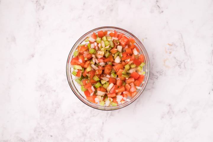 Tomato, celery, and onion salsa in a bowl.