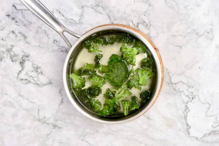 Broccoli cooking in boiling water.