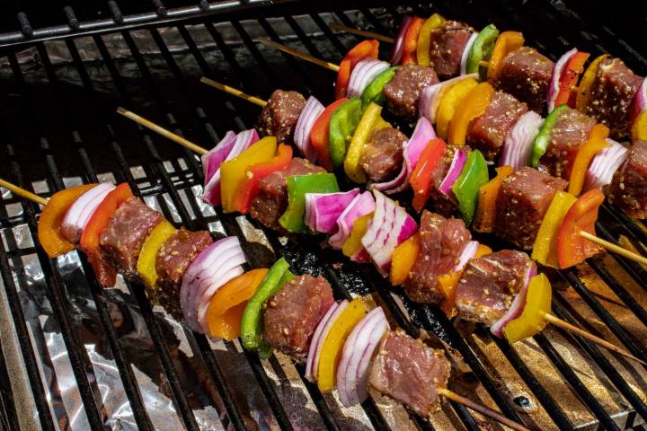 Teriyaki beef kabobs on a grill. 