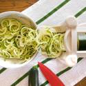 Plate of zucchini noodles being made with a spiralizer.