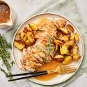 Instant Pot turkey tenderloin with roasted potatoes and fresh thyme.