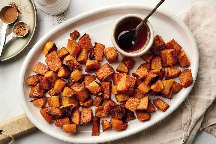 Cinnamon roasted butternut squash on a plate being served.