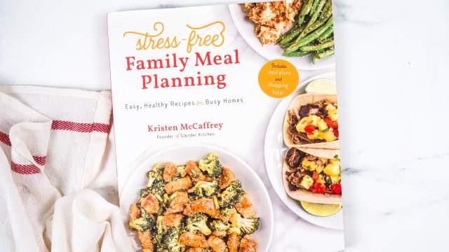 Stress Free Meal Planning cookbook and a cloth napkin.