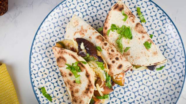 BBQ Portobello mushroom quesadillas with zucchini, red onions, mozzarella cheese, and barbecue sauce in a crispy tortilla.