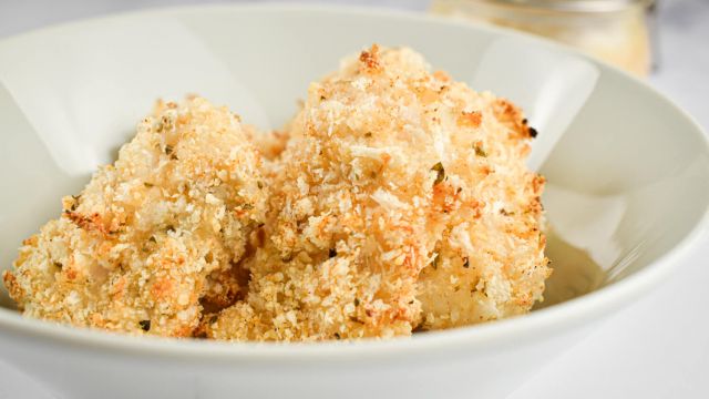 Baked Parmesan Fish Sticks in a bowl with a crispy panko and Parmesan crust.